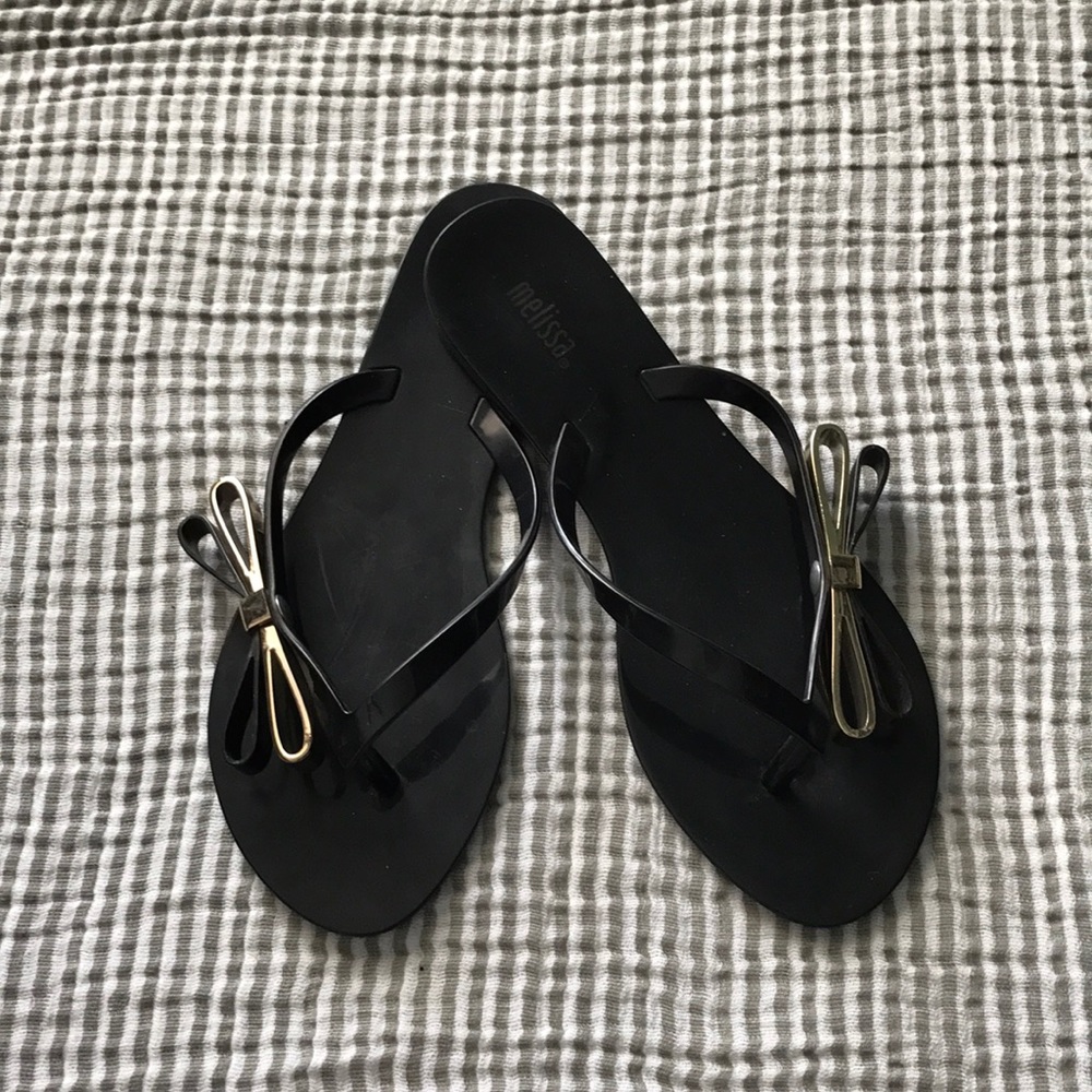 Melissa black sandals w/ gold bow accents